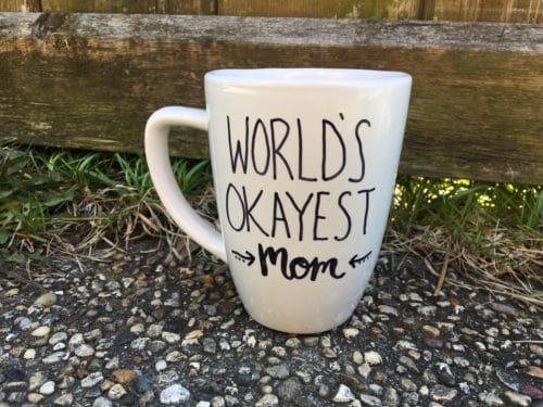 a mug with the phrase "world's okayest mom" on it for a Dollar Tree gift