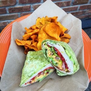 picture of Turkey Avocado Club Wrap and sweet potato chips