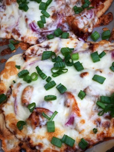 close up picture of bbq chicken naan