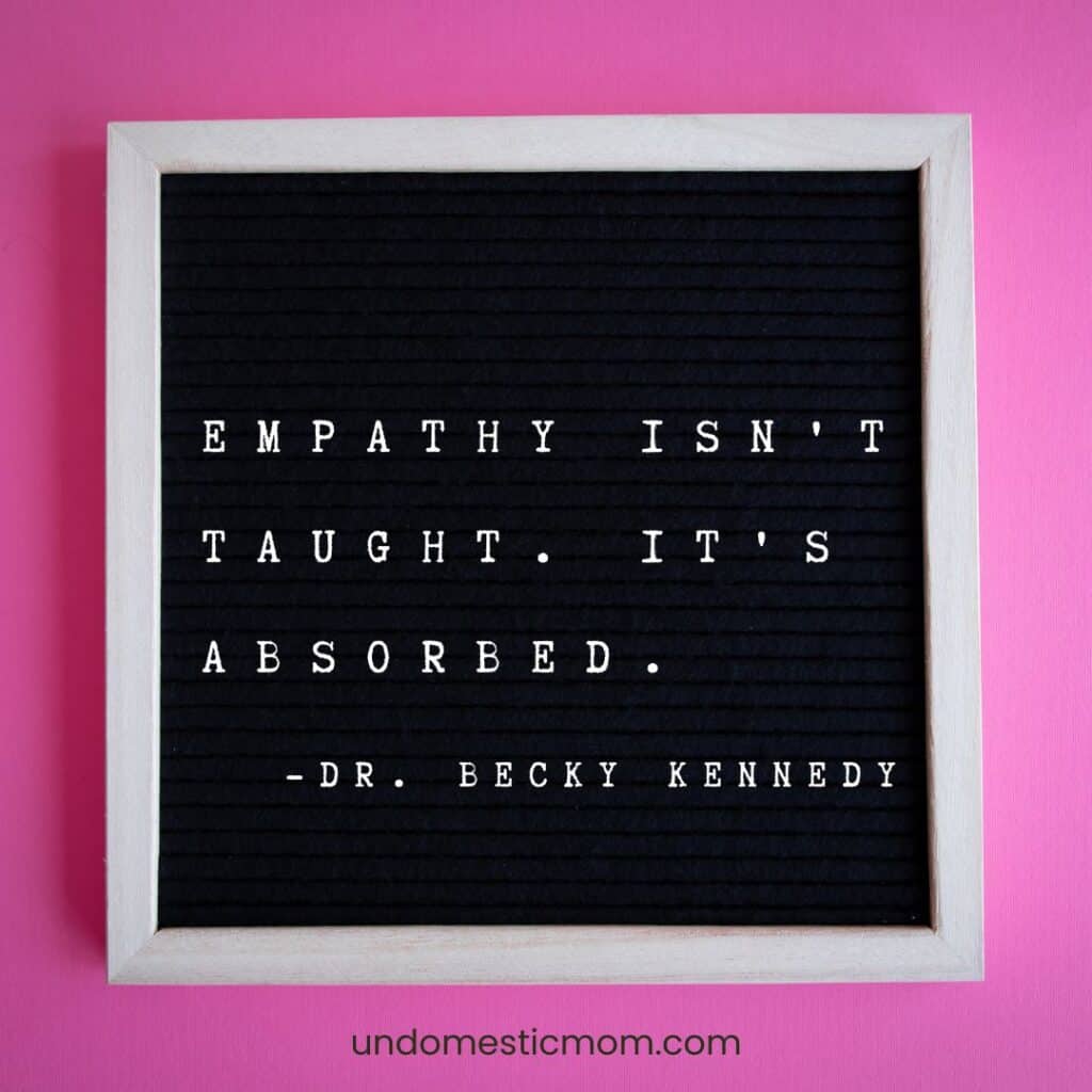 pink background with a letter board on it that says "empathy isn't taught. it's absorbed. dr. becky kennedy"